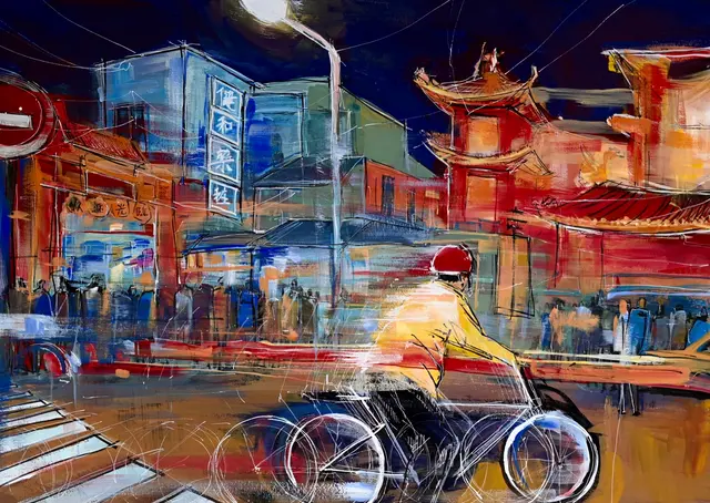 A cyclist passing through a layered city street painted in deep blue and orange.